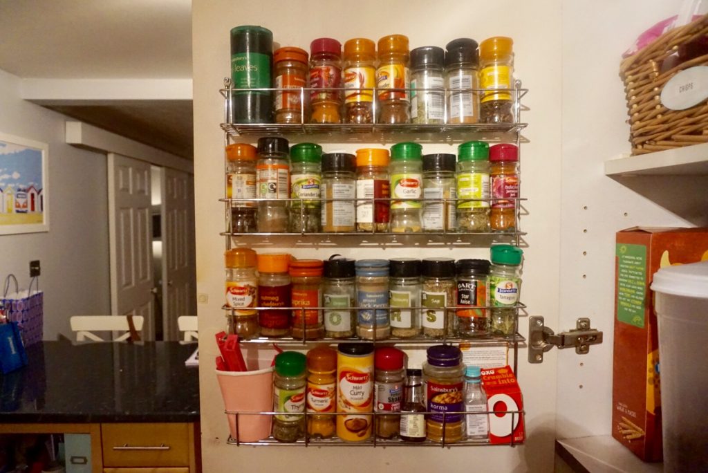Spice rack on the back of the kitchen cupboard door
